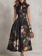Vestido midi de satén negro plisado de Noura Madrid