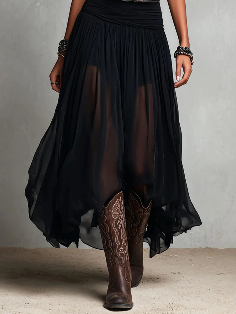 Conjunto negro con falda larga de tul de Noura Madrid
