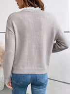 Jersey elegante con cuello de encaje de Noura Madrid